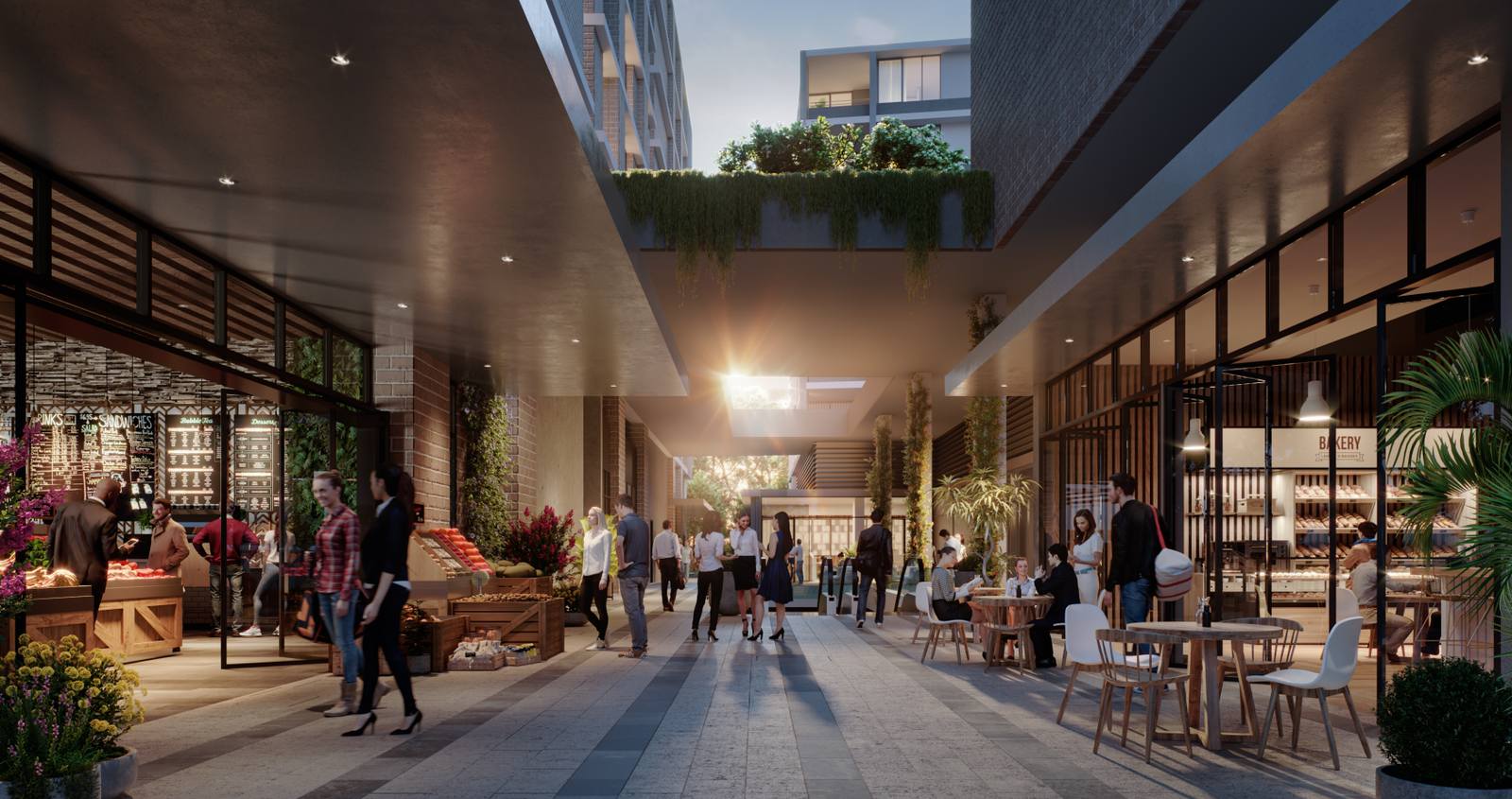 Artist's impression of Tallawong Village retail precinct showing a pedestrian laneway with bakery, fresh produce stalls, outdoor cafe seating and evening lighting